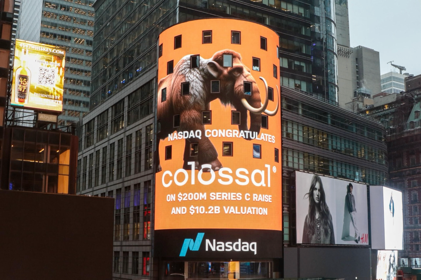 Nasdaq Times Square billboard congratulating Colossal on $200M Series C raise and $10.2B valuation